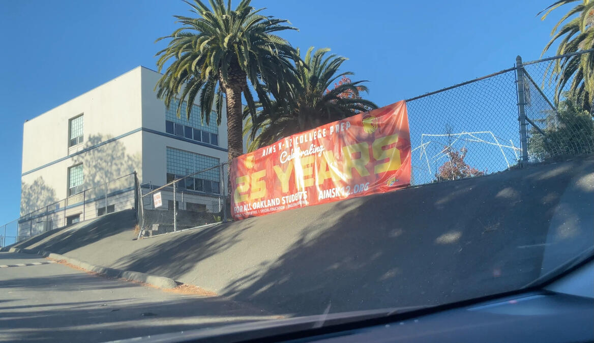 The banner which faces to the driveway from Grand Ave and visible from the I-580 freeway